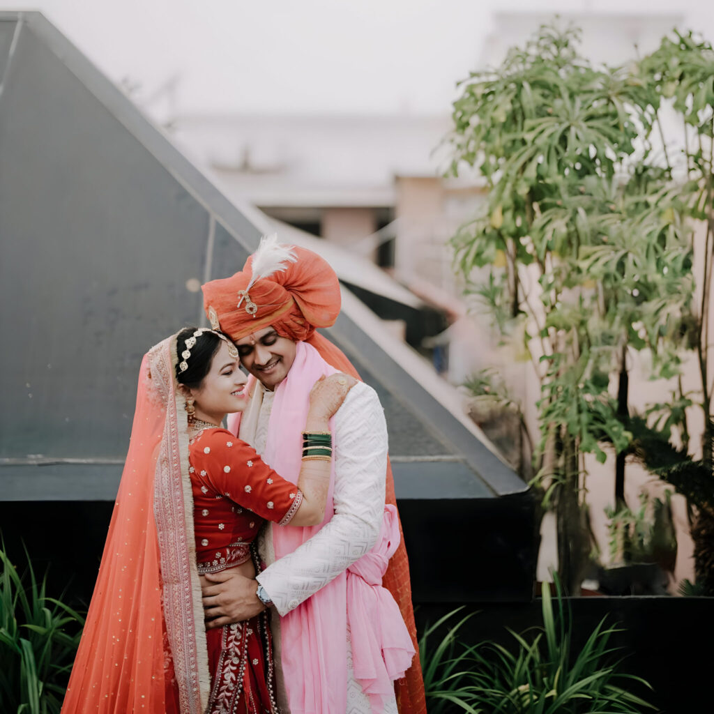 man woman are standing front building